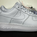 White leather low-top sneaker close-up, Nike swoosh and padded midsole