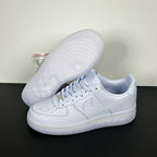 White leather low-top sneakers with textured rubber outsole, side and heel view