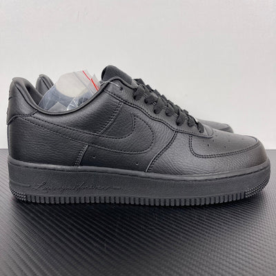 Air Force 1 sneakers in dark gray leather, lace-up with swoosh and textured rubber sole