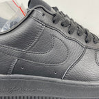 Air Force 1 sneaker upper close-up in dark gray leather, swoosh and lace area stitching