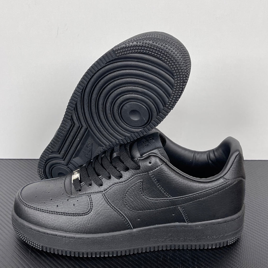 Air Force 1 sneaker outsole with circular traction pattern and dark gray leather upper