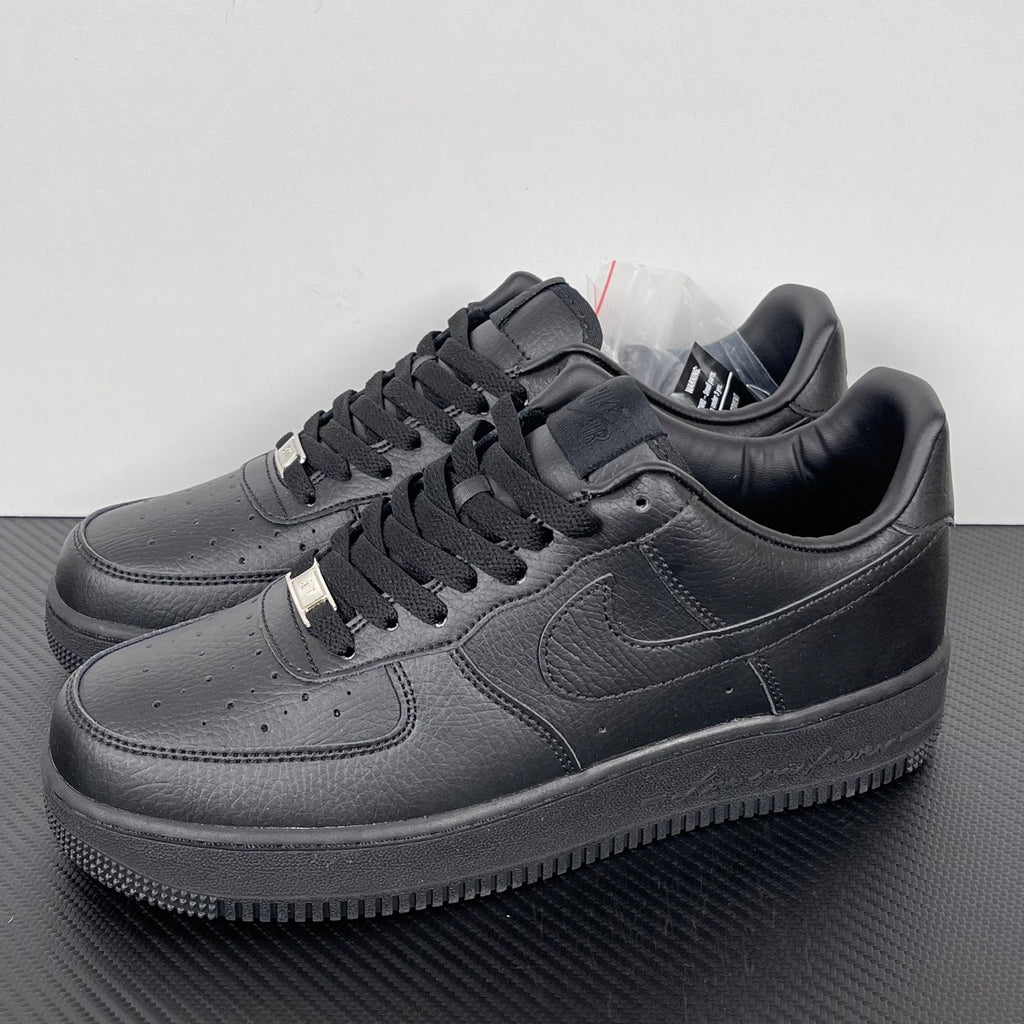 Air Force 1 sneakers front side view in dark gray leather, lace-up with swoosh