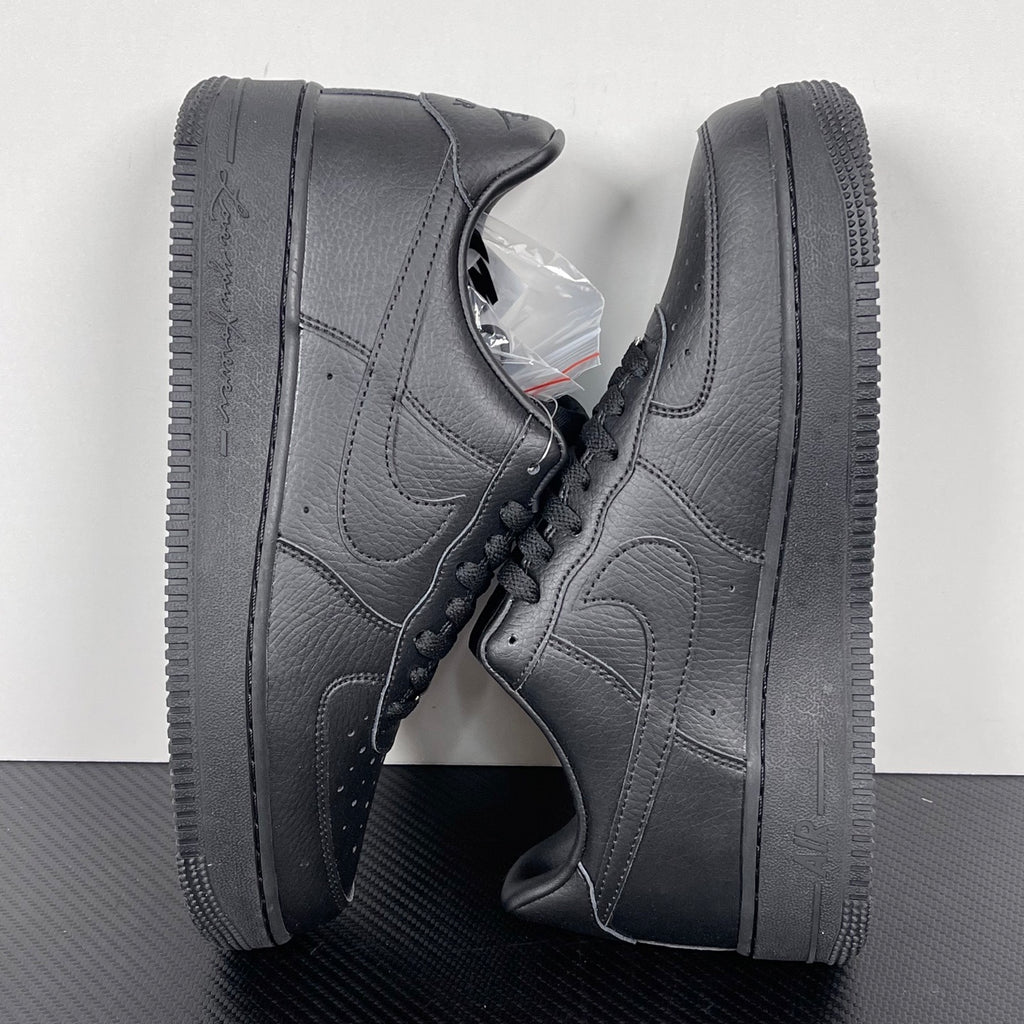 Air Force 1 sneakers angled view in dark gray leather, lace-up with swoosh and thick sole