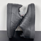 Air Force 1 sneakers angled view in dark gray leather, lace-up with swoosh and thick sole