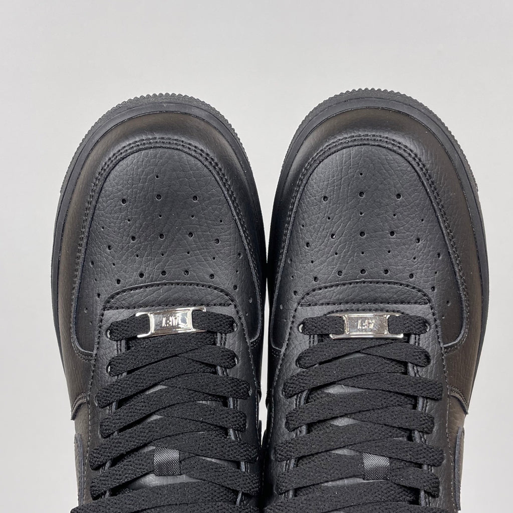 Air Force 1 sneakers toe view in dark gray leather, lace-up with perforated toe box