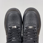 Air Force 1 sneakers toe view in dark gray leather, lace-up with perforated toe box