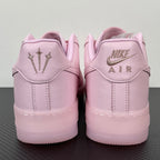 Pink low-top sneakers with Nike Air branding on heel tab