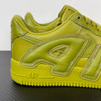 Lime green Air Force 1 sneaker showing front side panel and “AIR” heel logo