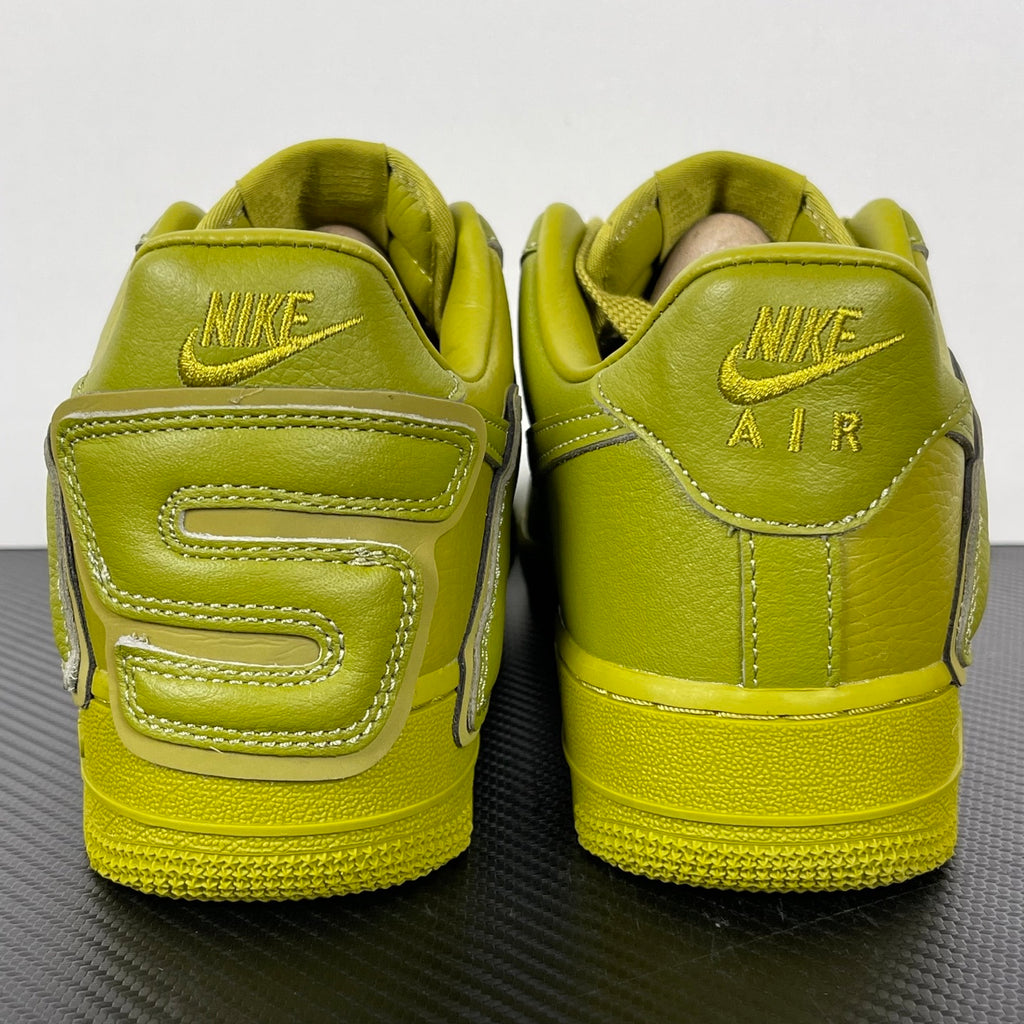 Lime green Air Force 1 sneakers viewed from the heel with NIKE AIR logos