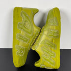 Lime green Air Force 1 sneakers, back view showing heel tabs and embroidered side logos