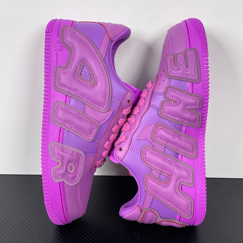 Purple Nike Air Force 1 sneakers, rear view showing heel cushioning and logo