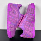 Purple Nike Air Force 1 sneakers, rear view showing heel cushioning and logo
