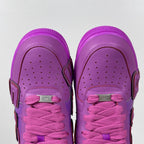 Purple Nike Air Force 1 sneakers, front view with pink lace-up closure and perforations